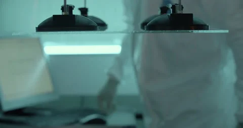 Suction cups puts down the glass on monitor's screen under worker's supervise Stock Footage 232789551