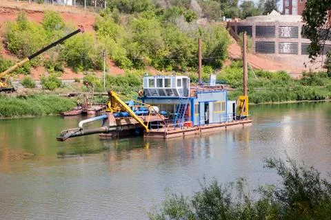 Suction dredger. Dredging on the river Stock Photos