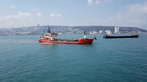 Suction Dredger ship working near the port - aerial 4k Stock Footage 111681235
