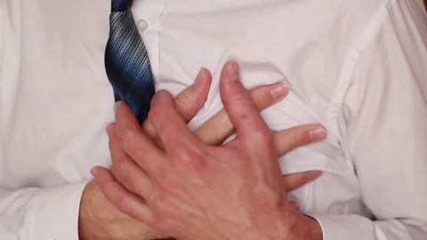 Sudden chest attack with businessman Vídeo Stock 73505622