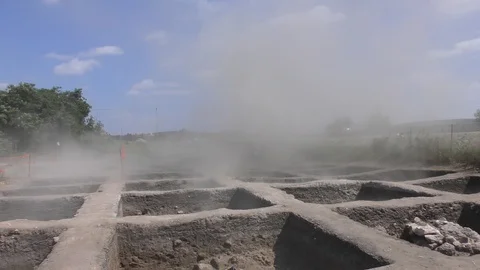 A sudden sand devil hits archaeological site exposing archaeoligical artifacts Видео 117855899