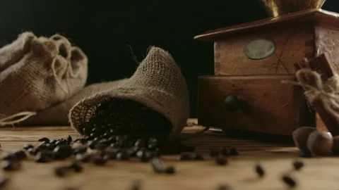 Suddenly falling jute bag with roasted coffee beans. Grains scattering slow Stock Footage 140365250