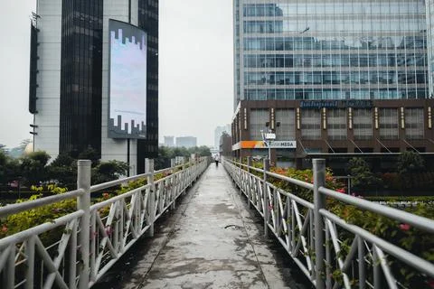 Sudirman pedestrian bridge is empty because after the rain Stock Photos