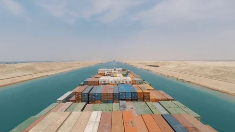Suez, Egypt - huge container vessel proceeding through the Suez Canal. Stock Footage