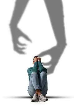 Suffering from hallucinations. Scared man closing eyes because of shadow of.. Fotos de archivo