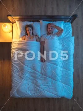 The suffering man lie near a woman. evening night time. view from above Stock Photos