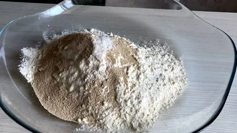 Sugar is added to flour with yeast Video stock 160498676