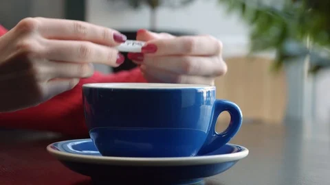 Sugar is Added to the Mug Stock Footage 87875984
