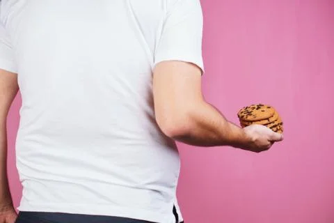 Sugar addiction, obese man with stack of cookies Stock Photos