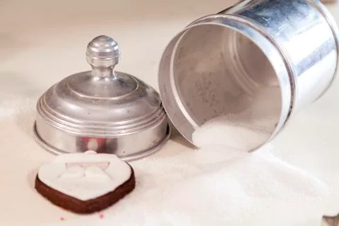 Sugar and biscuits on a white table Foto stock