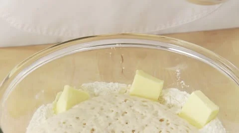 Sugar and salt being added to pre-risen dough 스톡 동영상 24640336