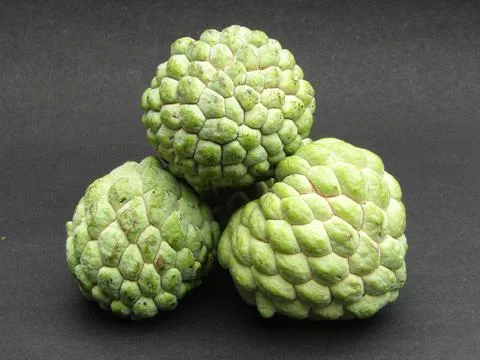 Sugar-apple on black background Fotos de archivo