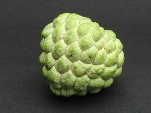 Sugar-apple on black background Фото