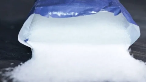 Sugar Bag falls over Frontal sight Closeup 動画素材 99166554