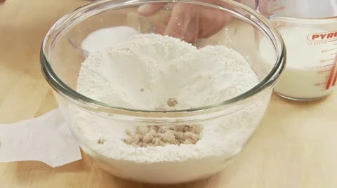 Sugar being added to flour and yeast Stock-Footage 24639946