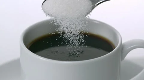 Sugar being poured into cup of coffee, Slow Motion Video stock 10700799