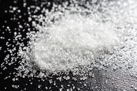 Sugar on a black background Stock Photos