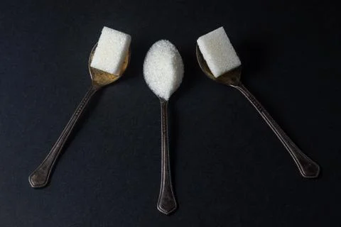 Sugar on a black background Stock Photos