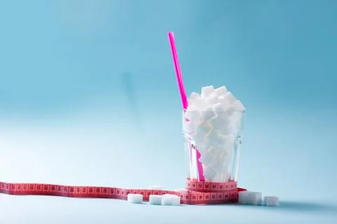 Sugar on blue background Stock Photos