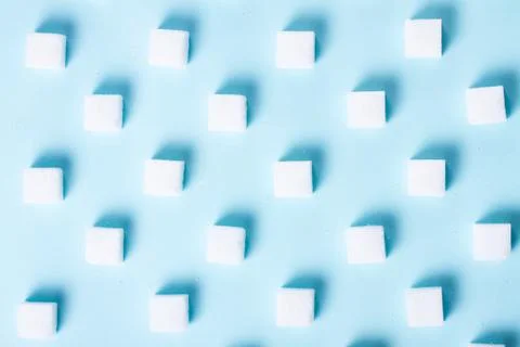 Sugar on blue background Stock Photos