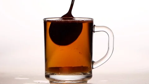 Sugar at the bottom cup stir with spoon. White background Stock Footage 73850354