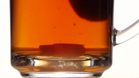 Sugar at the bottom of cup stir with spoon. Slow motion Stock Footage 73853880