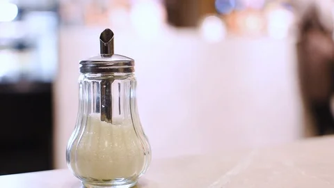 Sugar bowl on a table in a cafe. 库存影片 121114932