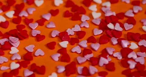 Sugar candies in the shape of hearts, red white and pink sugar candies for Stock Footage 293434045