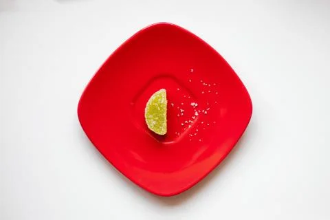 Sugar candy on a red plate Photos