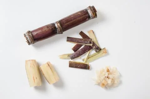Sugar cane condiments on white table Stock Photos