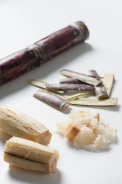 Sugar cane condiments on white table Stock Photos
