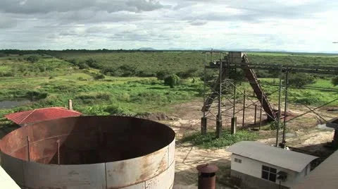 Sugar Cane Field In The Background and Processing Equipment in the Foreground Video stock 19021207