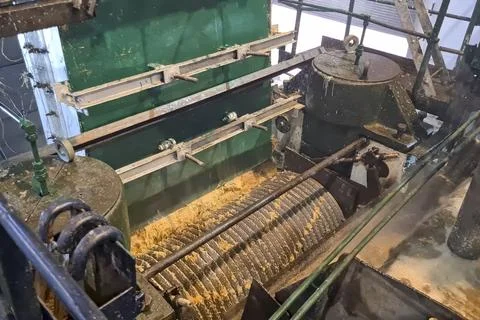 Sugar cane processing, plant, receiving drums and threshing mills, presses .. Fotos Stock