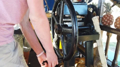 Sugar cane squeezing machine. Man squeez... | Stock Video | Pond5