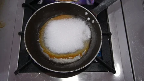 Sugar Caramelizing In A Pan. Stock Footage 105877913