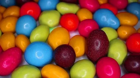 Sugar chocolate candy drops candies colorful footage video on slow motion Stock Footage 117362136