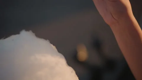 Sugar cloud in macro shot, Soft cotton candy illuminated at fair scene, Intimate Stock Footage 325336565