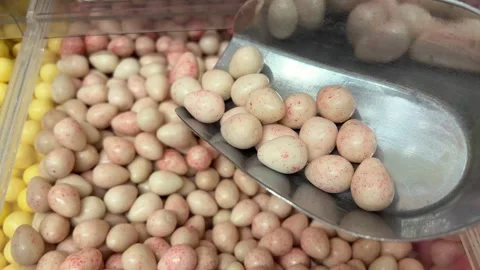 Sugar-coated peanuts Honey roasted coated peanuts extreme close up stock footage Stock Footage 323922427