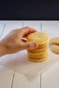 A sugar cookie in a man's hand 스톡 사진
