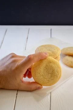 A sugar cookie in a man's hand 스톡 사진