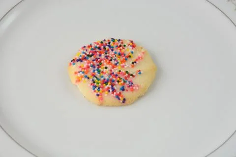 Sugar cookie with sprinkles Stock Photos