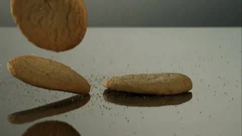 Sugar cookies falling and stacking on surface Stock Footage 327123210