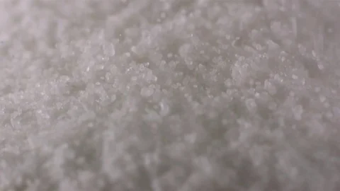 Sugar crystals falling against background in slow motion Stock Footage 71211887