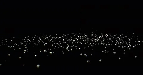 Sugar crystals falling on a black surface, close-up or Powder granules falling Stock Footage 149689764