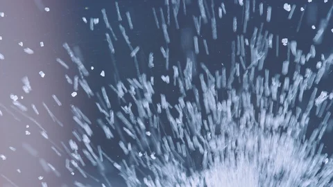Sugar crystals pour onto clear surface and fill the frame as seen from below Stock-Footage 129291719