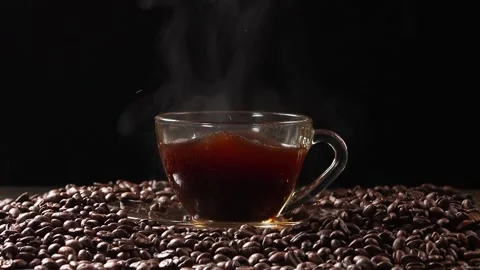 Sugar Cube Dropping into Hot Steaming Coffee Cup in Slow Motion Stock Footage 340302725