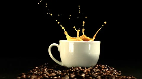 Sugar cube falling in coffee cup and splashing Stock Footage 22514507