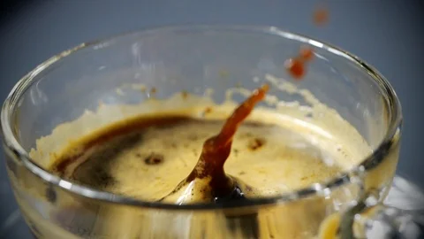 Sugar cube is falling into a coffee cup in slow motion Stock-Footage 113595460