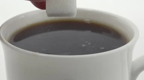 Sugar cube soaked in coffee. 4K UHD Stock Footage 48924329
