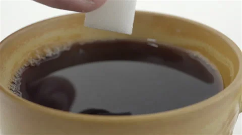 Sugar cube soaked in coffee. 4K UHD Stock Footage 48925755